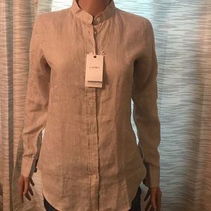 Cream button up shirt.